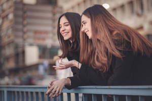 facts about stuttering two girls laughing talking speecheasy